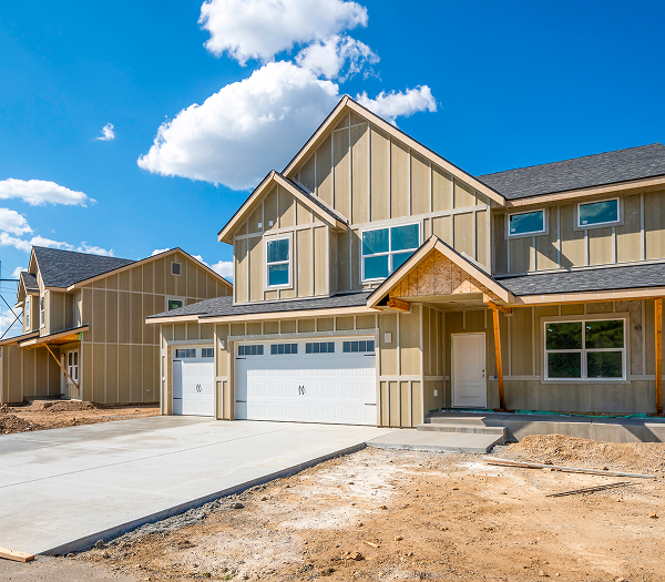 Modern suburban house under blue sky.