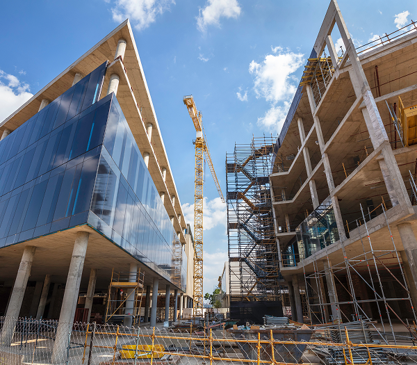 Construction site with crane and buildings.