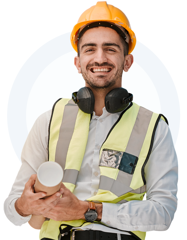 Smiling engineer holding blueprint, wearing safety gear.